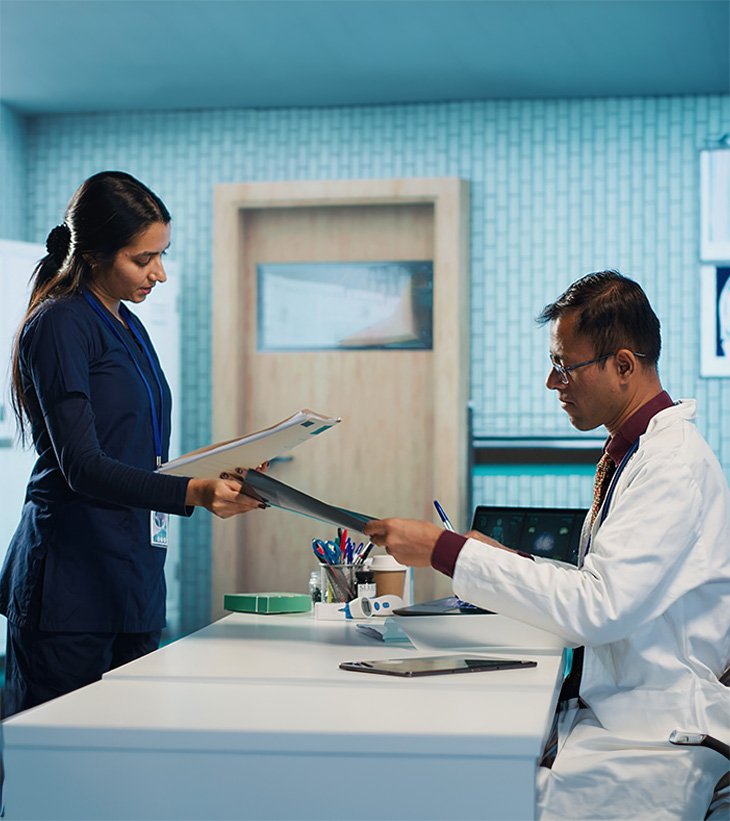 Two medical professionals conversing